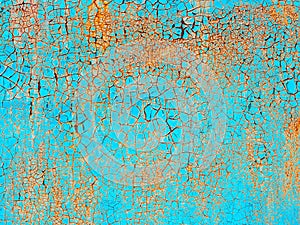 Abstract blue orange texture with grunge cracks. Cracked paint on a metal surface. Bright urban background with rough paint transi