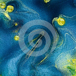 Abstract blue pigment with yellow insertions