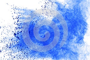 Abstract of blue powder explosion on white background. Blue powder splatted isolate. Colored cloud. Colored dust explode. Paint Ho