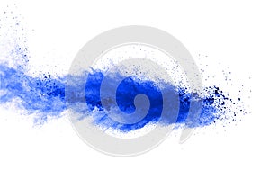 Abstract blue powder explosion on white background. Closeup of blue dust particles splash isolated on clear background