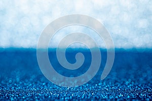 Abstract blue and silver sparkling bokeh wall and floor background studio.luxury holiday backdrop mock up for display of product.