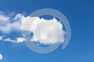 Abstract Blue sky background with tiny surrounded by small cloud.