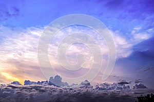 Abstract Blue Sky with Sunset-Lit CloudBlur Bokeh Light Background