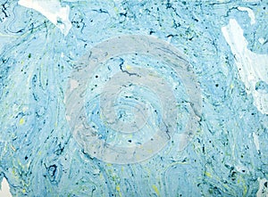 Abstract blue swirl background made from a can of paint.