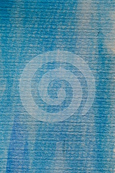 Abstract blue watercolor background. Blue watercolor on textured paper. Abstract texture and background for designers.