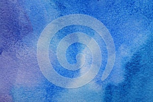 Abstract blue watercolor painting as background, top view