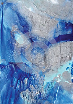 Abstract bluie and silver background made with hot wax.