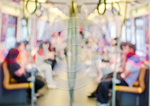 Abstract Blur Background, Defocus view of people is on the bts skytrain or Subway ,Blurred of people sitting on subway photo