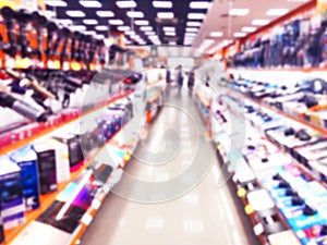 Abstract blur background with mobile store boutique in shopping mall. Electronic department store interior with bokeh light blurre