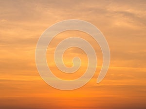 Abstract blur beautiful bright orange and golden sky at sunset sunrise for background