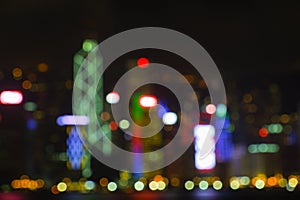 abstract blur city view of hongkong at victoria harbour on night day