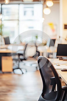 Abstract Blur Coworking Space with Desks and Laptops photo