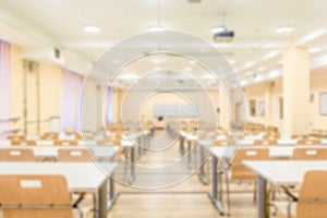 Abstract blur interior of empty University audiences. Modern school classroom on light defocus background.