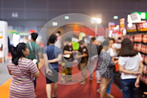 Abstract blur people in exhibition hall event trade show expo background. Business convention show, job fair, or stock market.