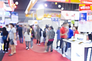 Abstract blur people in exhibition hall event trade show expo background. Business convention show, job fair, or stock market.