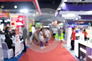 Abstract blur people in exhibition hall event trade show expo background. Business convention show, job fair, or stock market.