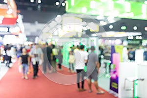 Abstract blur people in exhibition hall event trade show expo background. Business convention show, job fair, or stock market.