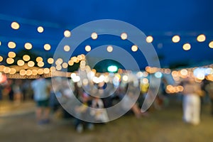 Abstract blur people in night festival city park bokeh background - vintage outdoor