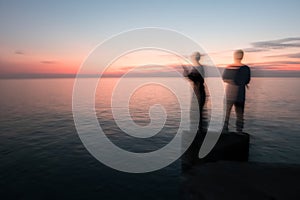 Abstract Blur silhouette of man fishing rod