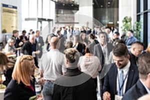 Abstract blured photo of business people socializing during banquet lunch break break at business meetin, conference or