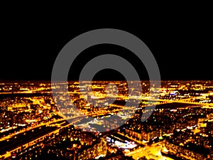 Abstract Blurred background Aerial night view of a big city. Cityscape panorama bokeh at night. Blurry Aerial view of skyscraper a