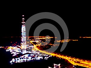 Abstract Blurred background Aerial night view of a big city. Cityscape panorama bokeh at night. Blurry Aerial view of skyscraper a