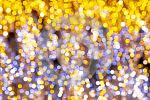 Abstract blurred background of golden and blue bokeh lights