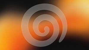 Abstract blurred background with a gradient of orange yellow and black