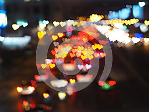 Abstract blurred background with heart bokeh of traffic lights