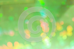 Abstract blurred background for layouts. On a green background, yellow spots in defocus.