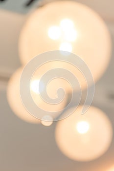 Abstract blurred background of light bulb decoration on hotel ce