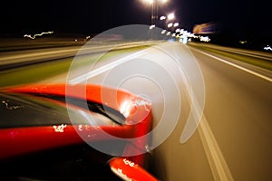 Abstract blurred background with red car