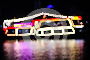 Abstract blurred of boat in night time with colorful reflection in river  background