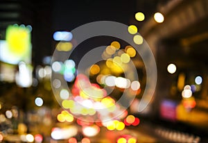 Abstract blurred bokeh background of car light on road