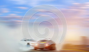 Abstract blurred car wheel drifting and smoking on track. Sport