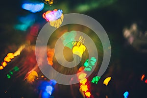 Abstract blurred colorful christmas bokeh heart background