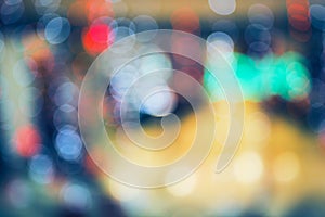 Abstract blurred and defocused background of shopping mall with bokeh. Christmas lights and garlands