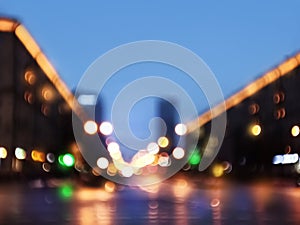 Abstract blurred defocused night city background with traffic lights bokeh