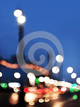 Abstract blurred defocused night city background with traffic lights bokeh