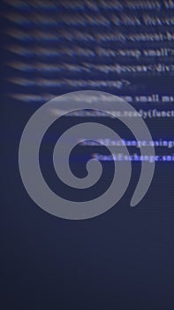 Abstract blurred digital code on a dark screen, representing programming, cybersecurity, and technology