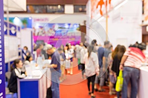 Abstract blurred event exhibition with people background, business convention show concept. photo