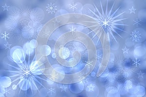 Abstract blurred festive light blue winter christmas or Happy New Year background texture with shiny blue and white bokeh lighted