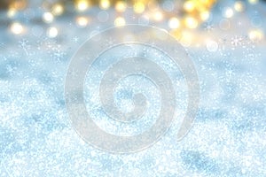 Abstract blurred festive winter christmas or Happy New Year background with shiny blue and white bokeh lighted snow landscape.