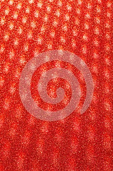 Abstract blurred glitter background in red colors.Mysterious defocused background