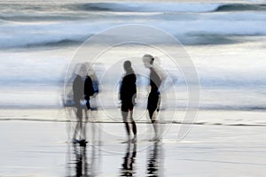 Abstract blurred group of people on a beach