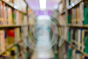 Abstract blurred image of books on bookshelf in school library. education learning or back to school concept background.