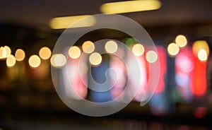 Abstract blurred image of cafe or restaurant with bokeh lights background at night