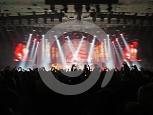 Abstract blurred image. Crowd during a entertainment public concert a musical performance. Hand fans in fun zone people