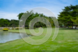 Abstract Blurred image of Green bright nature grass field, tree greenery background