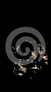 Abstract blurred light and shadow pattern on a dark water surface background